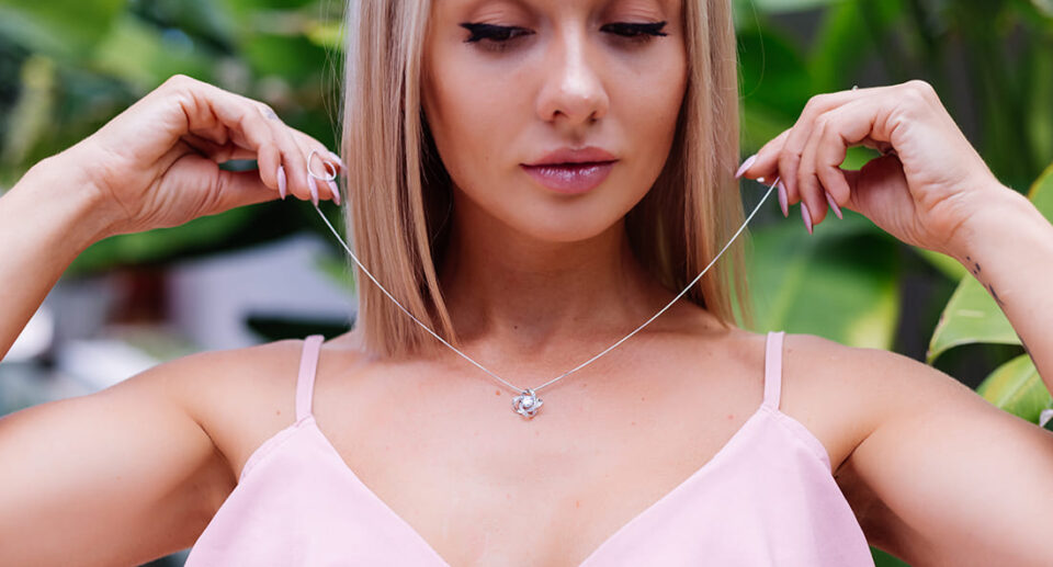 outdoor-portrait-woman-pink-romantic-dress-wearing-necklace